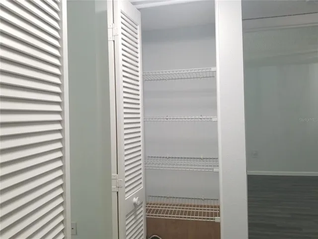 a bathroom with a shower sink vanity and toilet