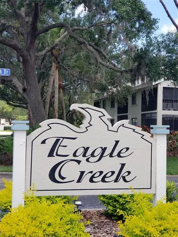 a view of a patio with swimming pool table and chairs