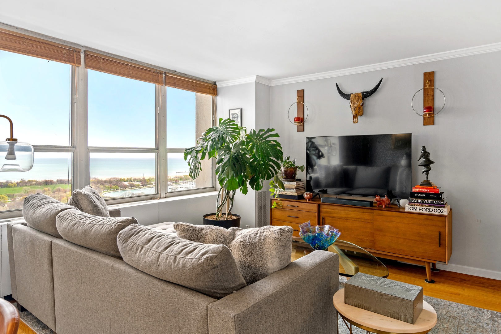 655 West Irving Park Road, Unit 3608 Chicago, IL 60613 - Photo 12 of 37 a living room with furniture and a flat screen tv
