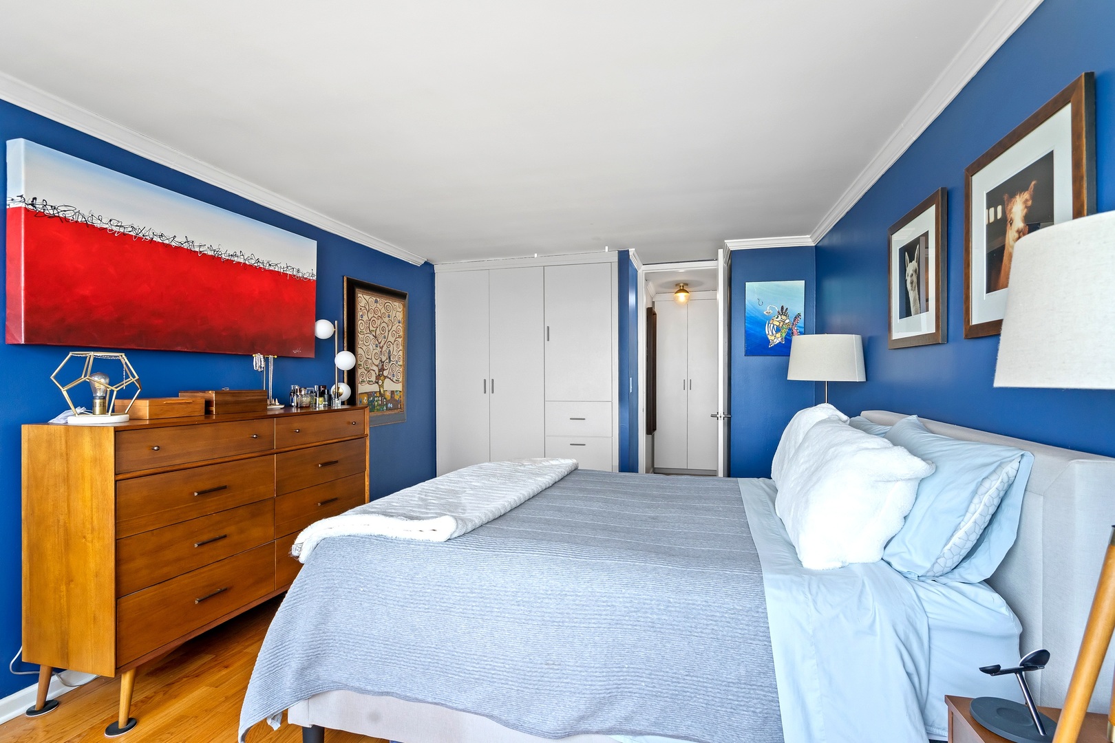655 West Irving Park Road, Unit 3608 Chicago, IL 60613 - Photo 17 of 37 a bedroom with a bed and a flat screen tv