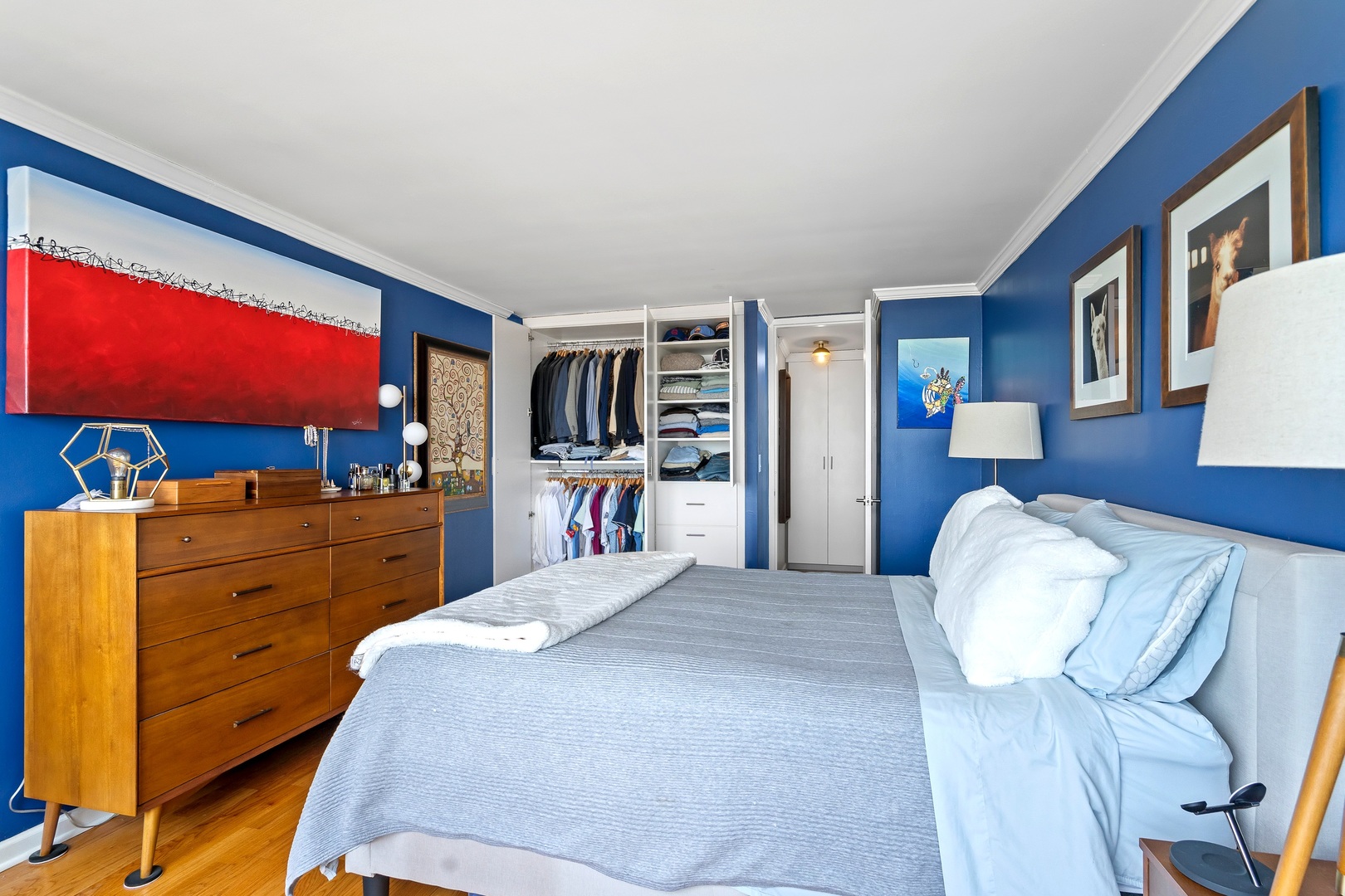 655 West Irving Park Road, Unit 3608 Chicago, IL 60613 - Photo 18 of 37 a bedroom with a bed and dresser