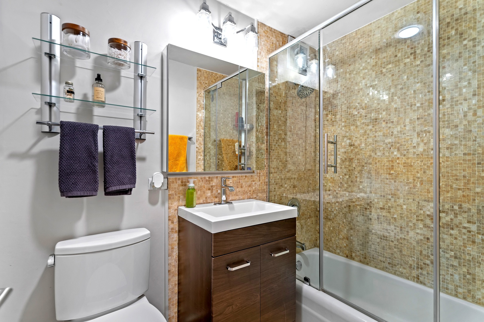 655 West Irving Park Road, Unit 3608 Chicago, IL 60613 - Photo 19 of 37 a bathroom with a sink a toilet and shower