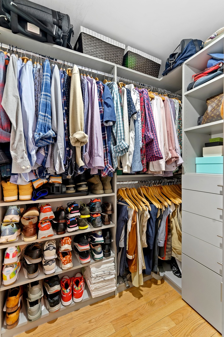 655 West Irving Park Road, Unit 3608 Chicago, IL 60613 - Photo 20 of 37 a view of walk in closet with clothes and shoes