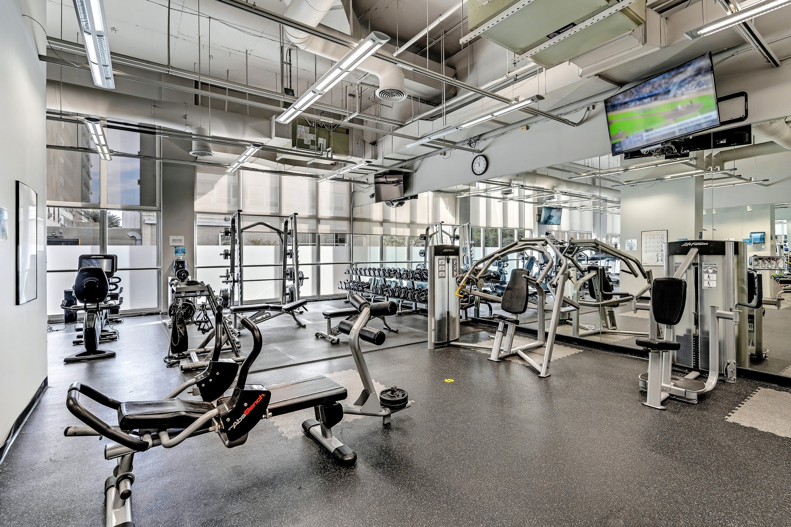 655 West Irving Park Road, Unit 3608 Chicago, IL 60613 - Photo 32 of 37 a view of a room with gym equipment