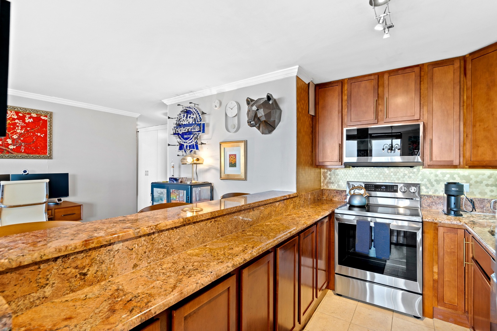 655 West Irving Park Road, Unit 3608 Chicago, IL 60613 - Photo 7 of 37 a kitchen with stainless steel appliances granite countertop a sink stove and cabinets