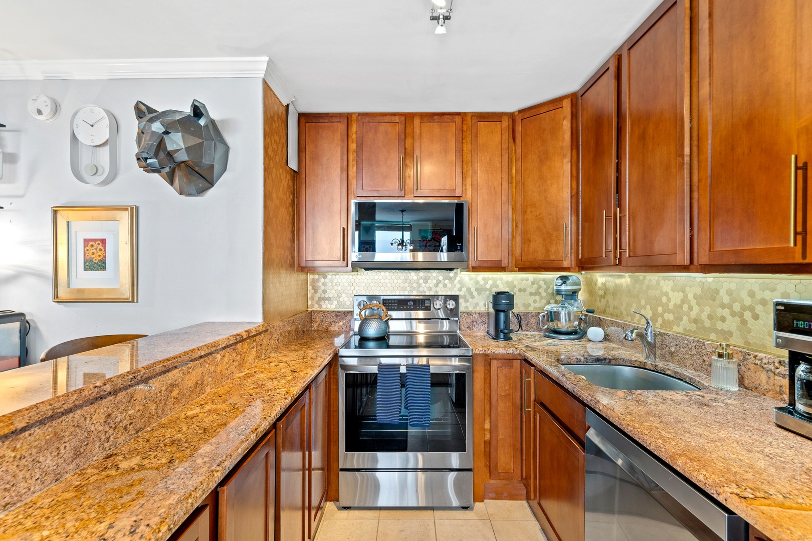 655 West Irving Park Road, Unit 3608 Chicago, IL 60613 - Photo 8 of 37 a kitchen with stainless steel appliances granite countertop a stove a sink and a microwave