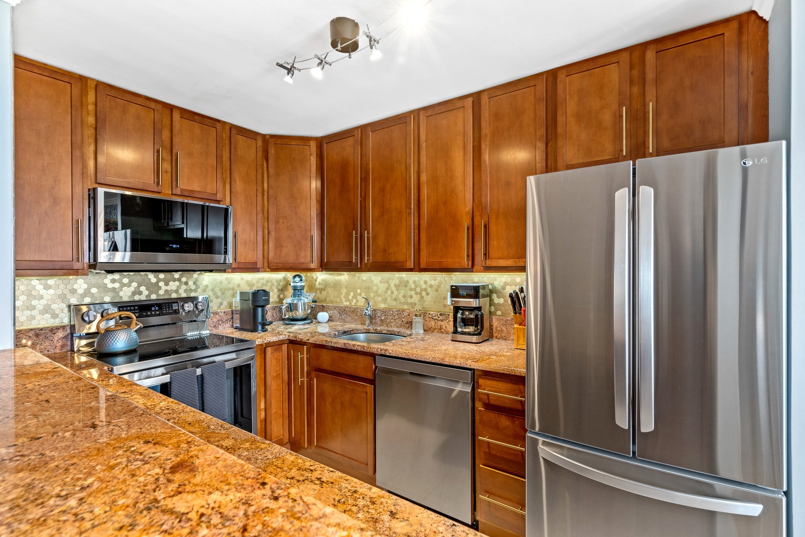 655 West Irving Park Road, Unit 3608 Chicago, IL 60613 - Photo 9 of 37 a kitchen with stainless steel appliances a refrigerator stove and sink