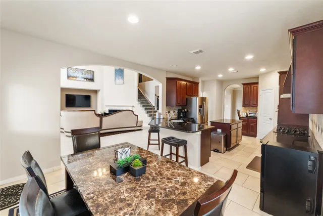 a view of a dining room with furniture window and outside view