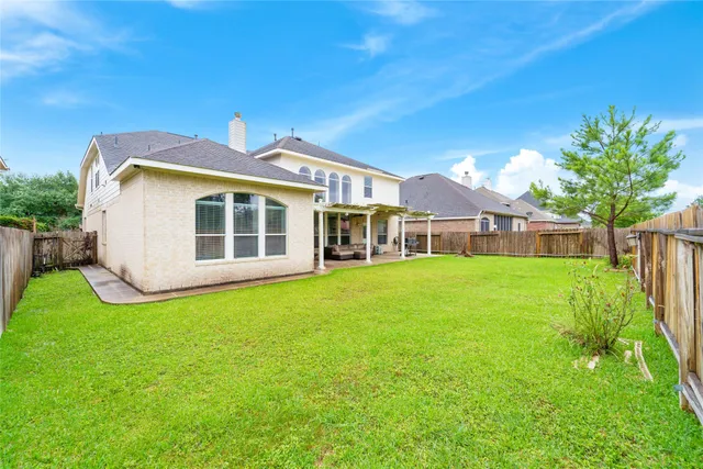 a front view of house with yard and seating area