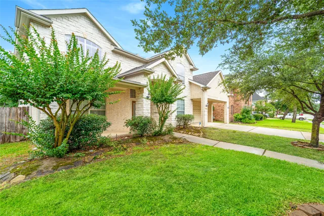 a house view with a garden space