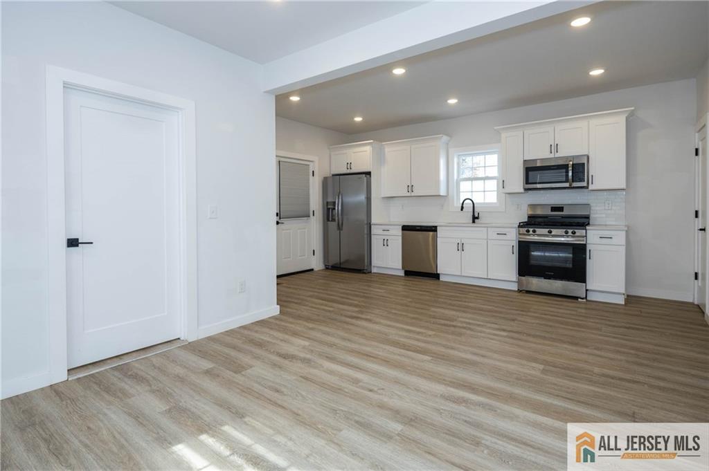 27 South 2nd Street Fords, NJ 08863 - Photo 11 of 33 a view of a kitchen with a sink and a stove top oven