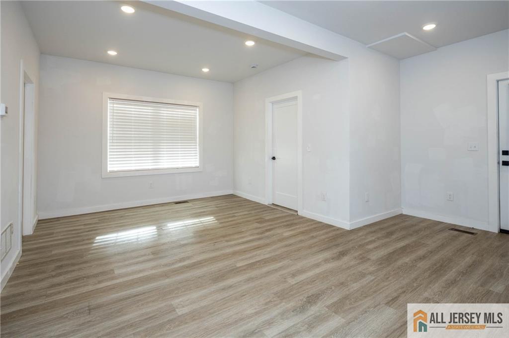 27 South 2nd Street Fords, NJ 08863 - Photo 13 of 33 an empty room with wooden floor and windows