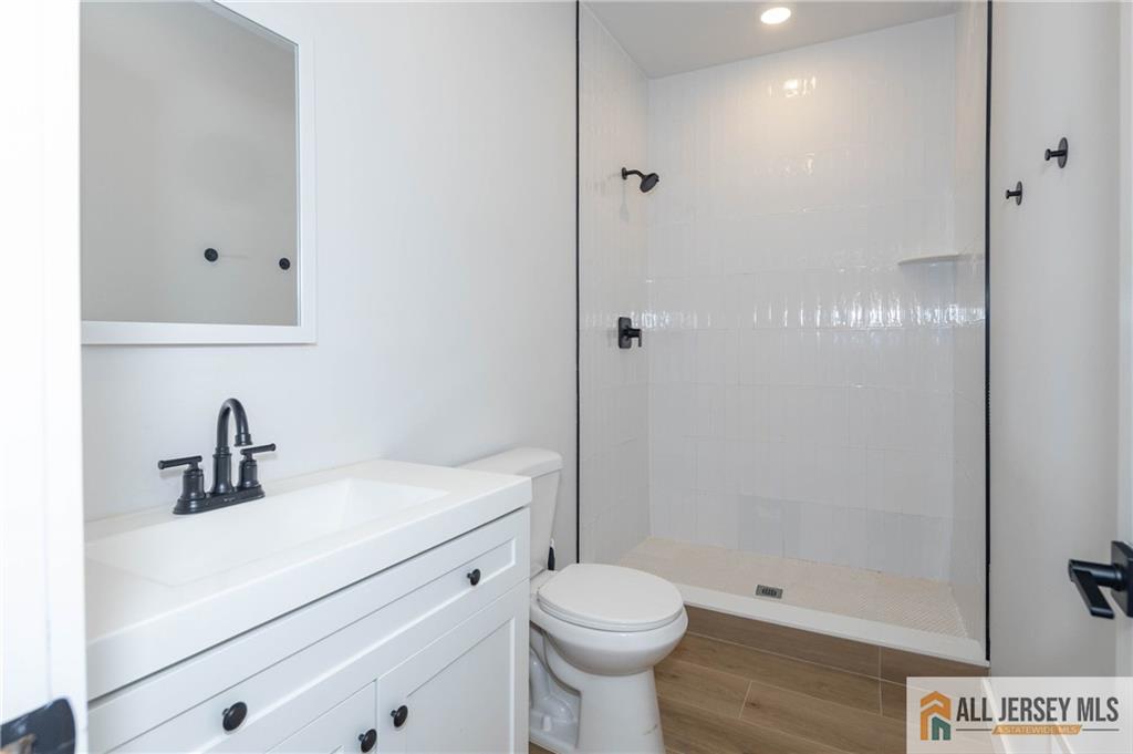 27 South 2nd Street Fords, NJ 08863 - Photo 17 of 33 a bathroom with a sink a toilet and shower