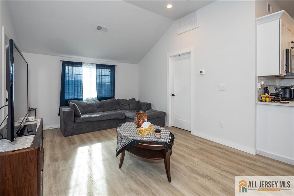 27 South 2nd Street Fords, NJ 08863 - Photo 22 of 33 a living room with furniture and a flat screen tv