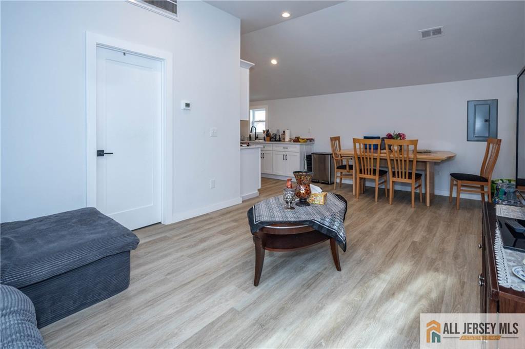 27 South 2nd Street Fords, NJ 08863 - Photo 23 of 33 a living room with furniture and a wooden floor