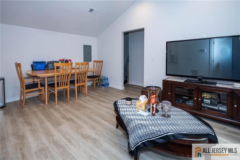 27 South 2nd Street Fords, NJ 08863 - Photo 24 of 33 a living room with furniture and a flat screen tv