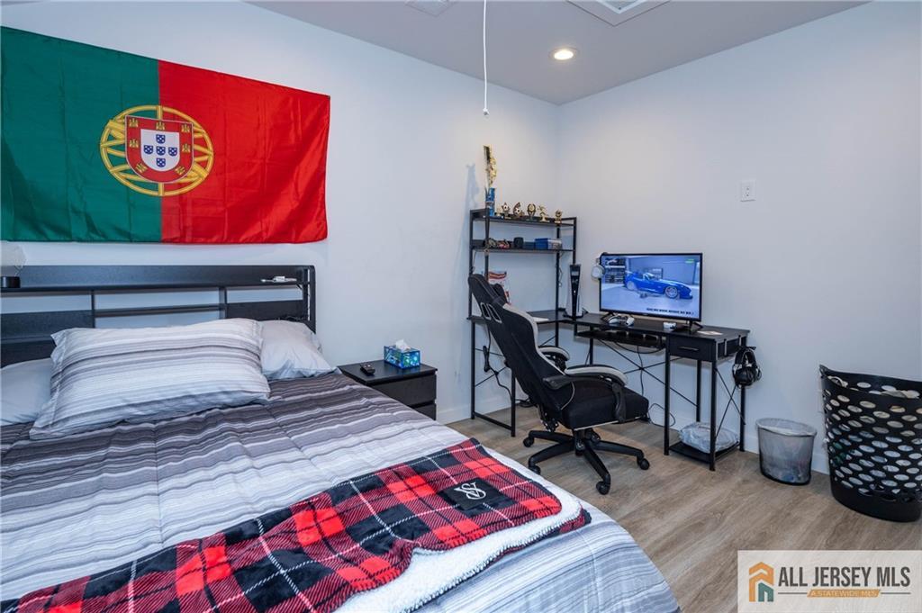 27 South 2nd Street Fords, NJ 08863 - Photo 27 of 33 a bedroom with a bed and a desk in it