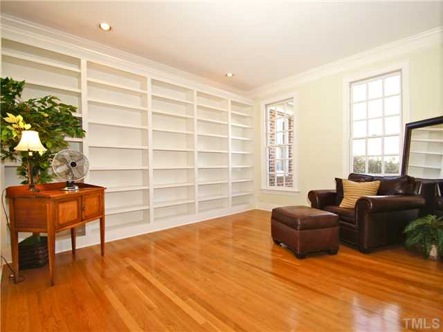 5256 Mill Dam Road Wake Forest, NC 27587 - Photo 7 of 25 ~The living room (library) has wall-to-wall, floor-to-ceiling built-in bookshelves.~
