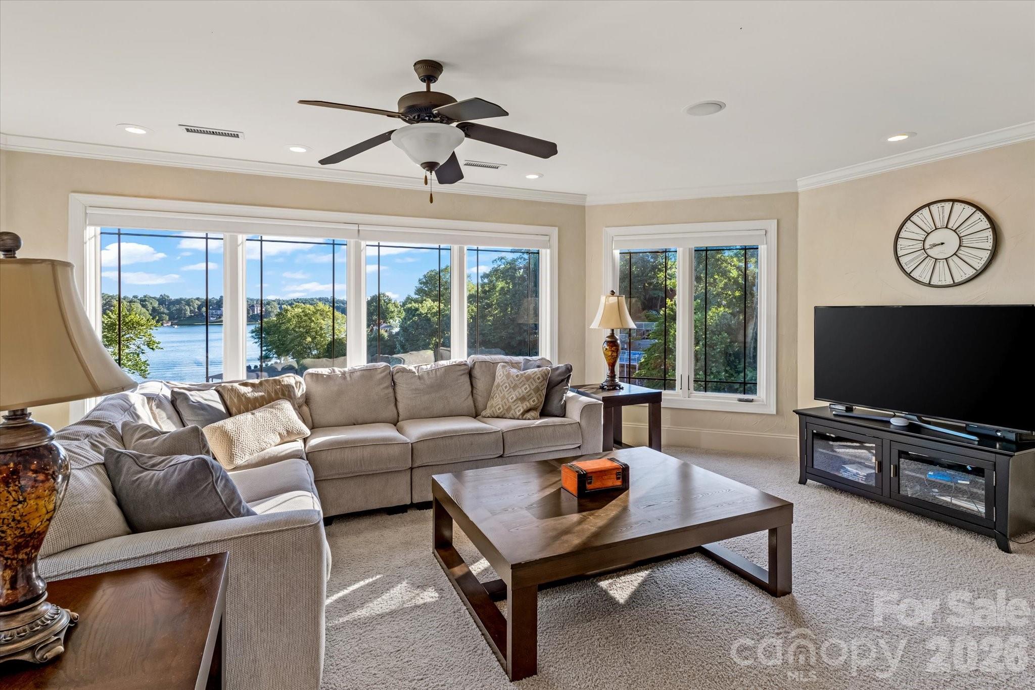 368 Players Ridge Road Hickory, NC 28601 - Photo 21 of 48 a living room with furniture a flat screen tv and a large window