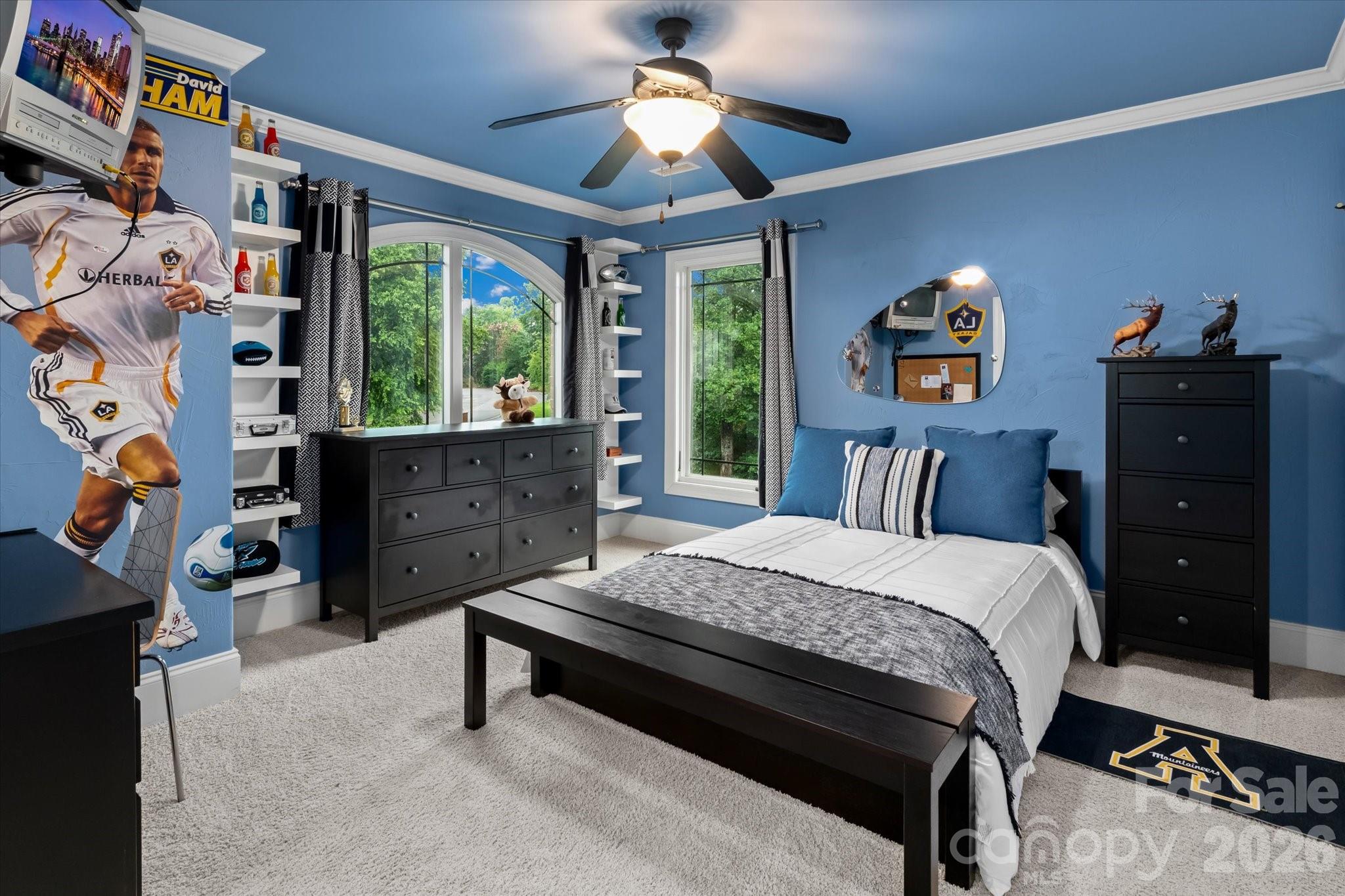 368 Players Ridge Road Hickory, NC 28601 - Photo 26 of 48 a bedroom with a bed and a chandelier