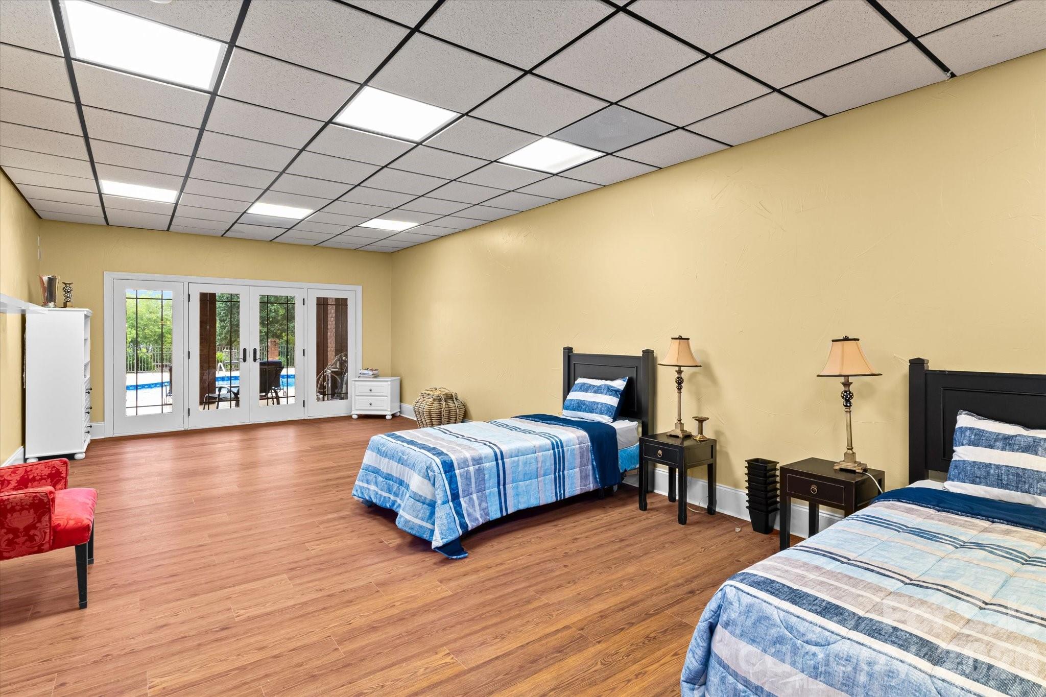 368 Players Ridge Road Hickory, NC 28601 - Photo 34 of 48 a spacious bedroom with two beds and wooden floor