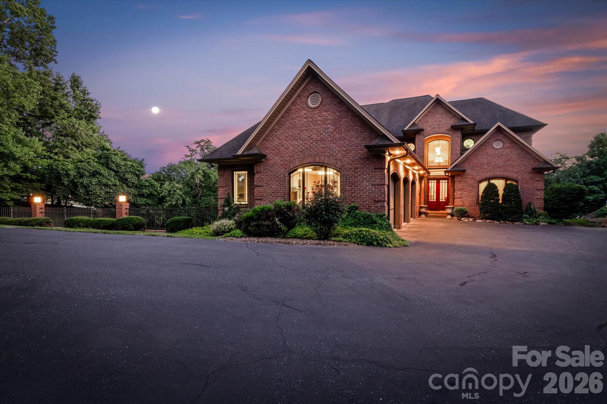 368 Players Ridge Road Hickory, NC 28601 - Photo 48 of 48 a front view of a house with a yard and garage
