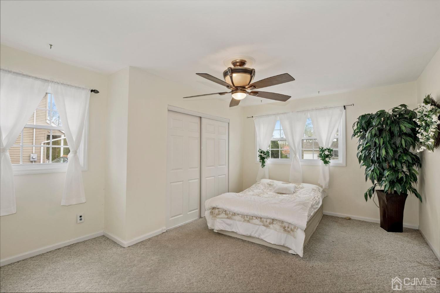 59 Clipper Avenue Edison, NJ 08817 - Photo 14 of 29 a bedroom with a bed and a potted plant