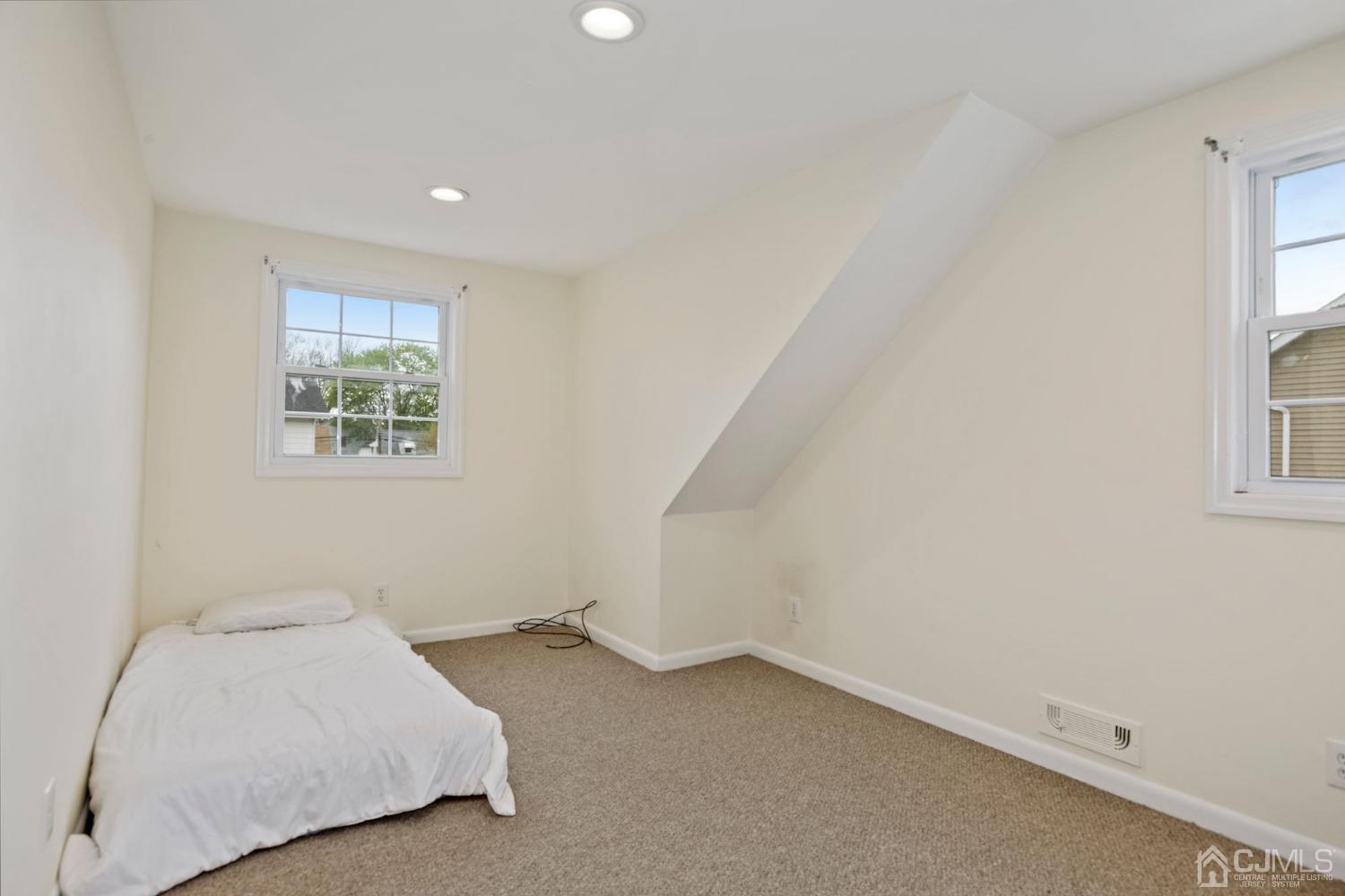 59 Clipper Avenue Edison, NJ 08817 - Photo 16 of 29 a room with a bed and a window