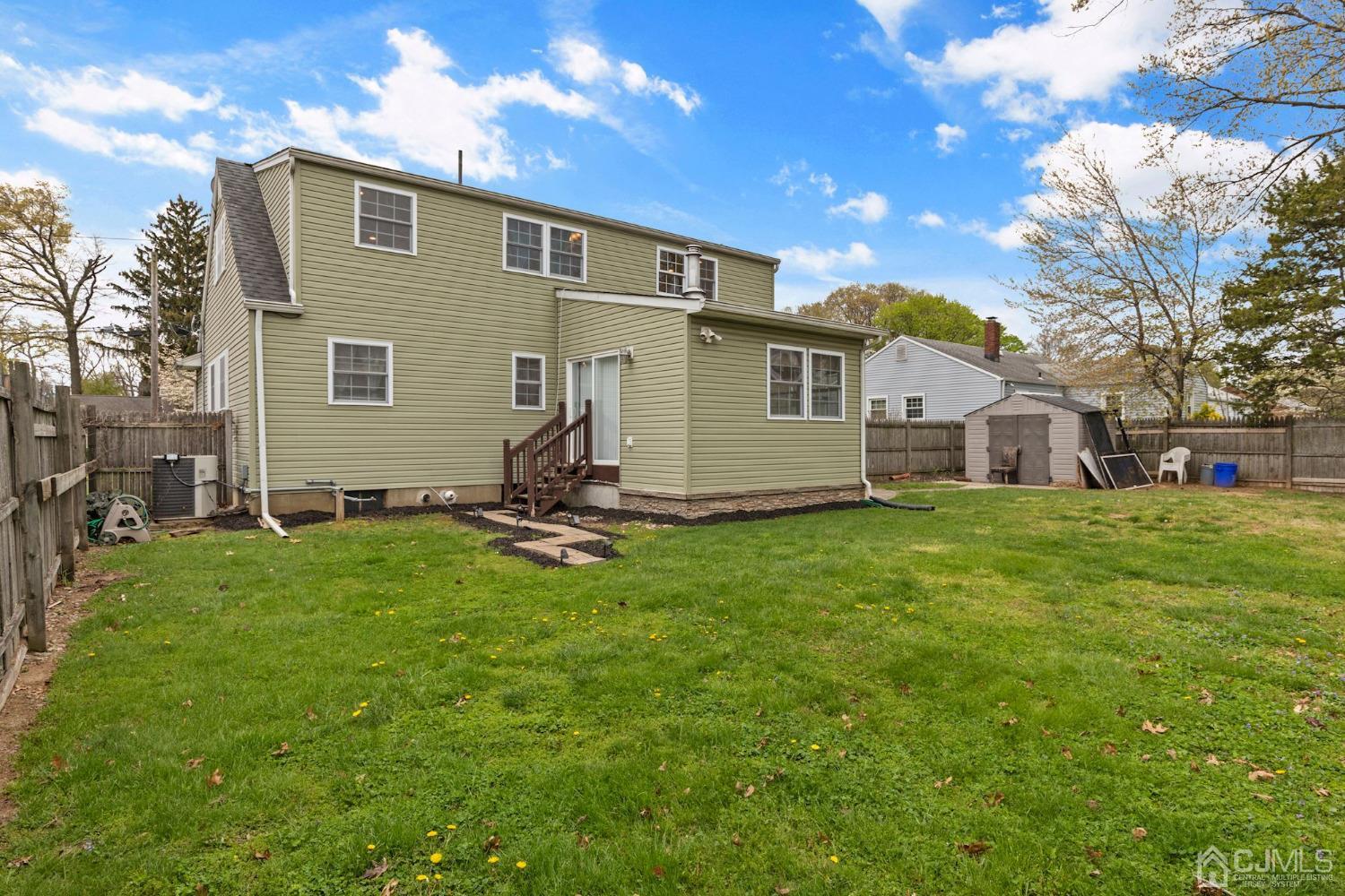 59 Clipper Avenue Edison, NJ 08817 - Photo 27 of 29 a front view of a house with a yard