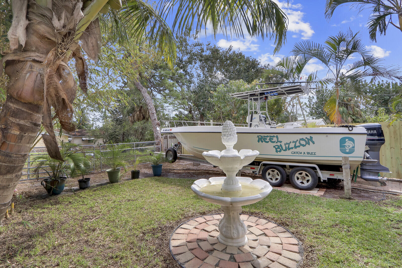 503 North Perry Avenue Jupiter, FL 33458 - Photo 12 of 44 a view of a chairs and table in the backyard