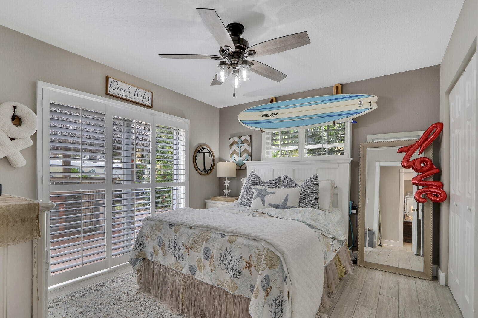 503 North Perry Avenue Jupiter, FL 33458 - Photo 22 of 44 a bedroom with a bed and a chandelier