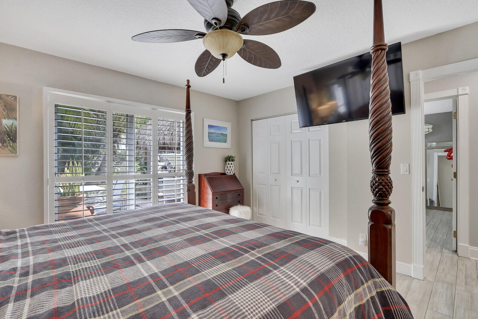 503 North Perry Avenue Jupiter, FL 33458 - Photo 24 of 44 a bedroom with a bed a window and a flat screen tv