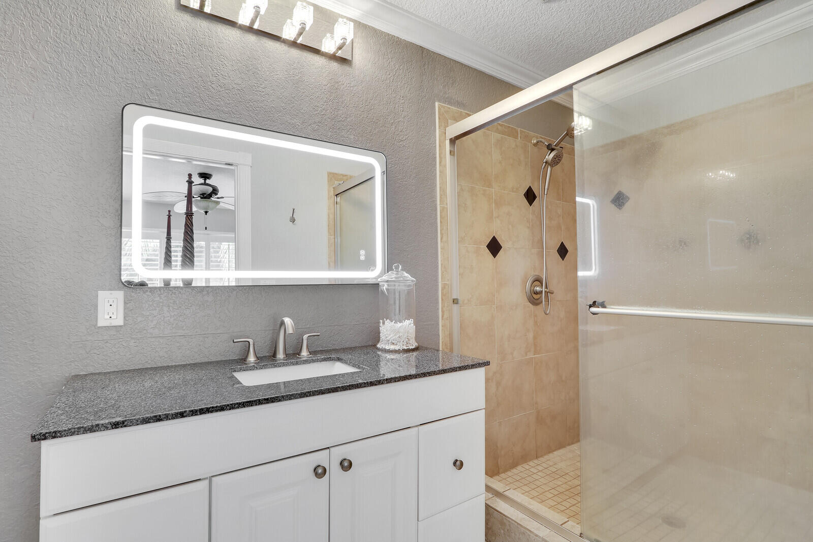 503 North Perry Avenue Jupiter, FL 33458 - Photo 26 of 44 a bathroom with a granite countertop sink mirror and shower