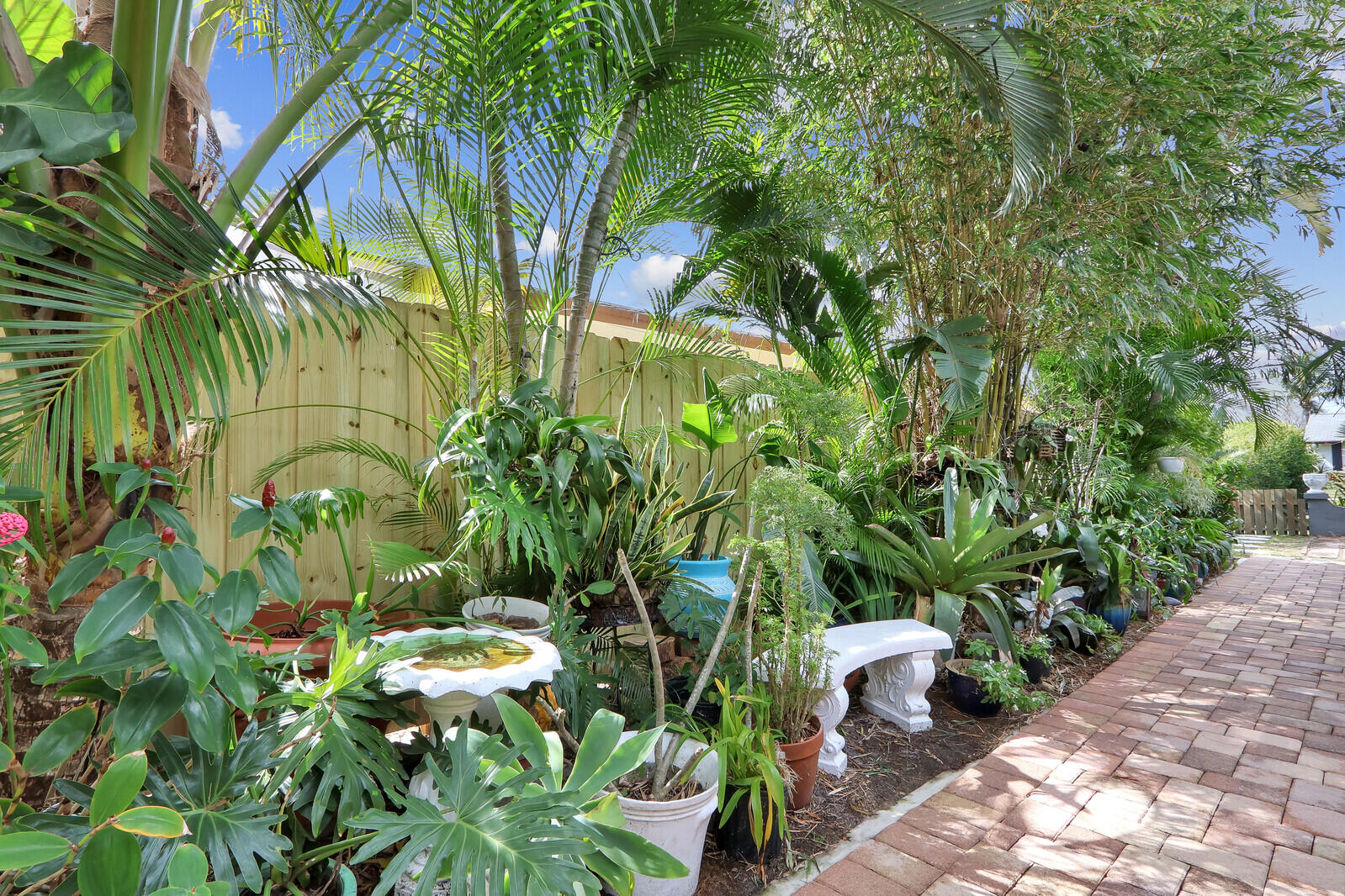 503 North Perry Avenue Jupiter, FL 33458 - Photo 28 of 44 a backyard of a house with lots of green space