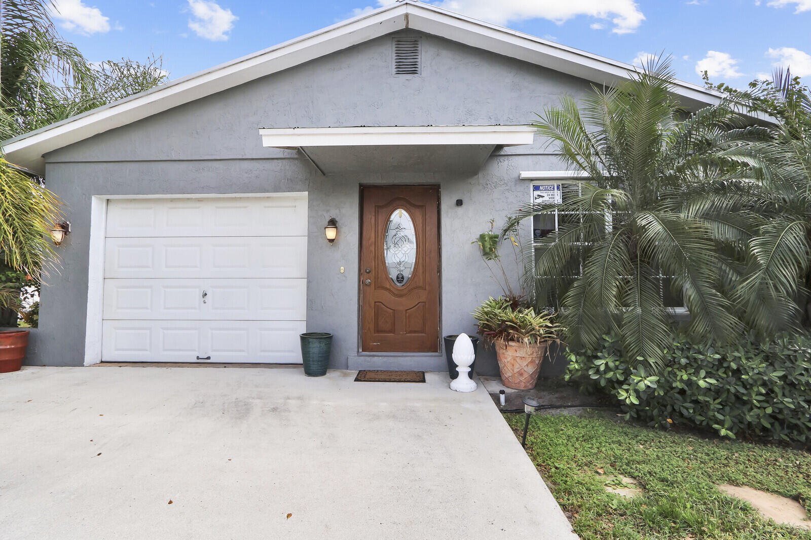 503 North Perry Avenue Jupiter, FL 33458 - Photo 3 of 44 a front view of a house