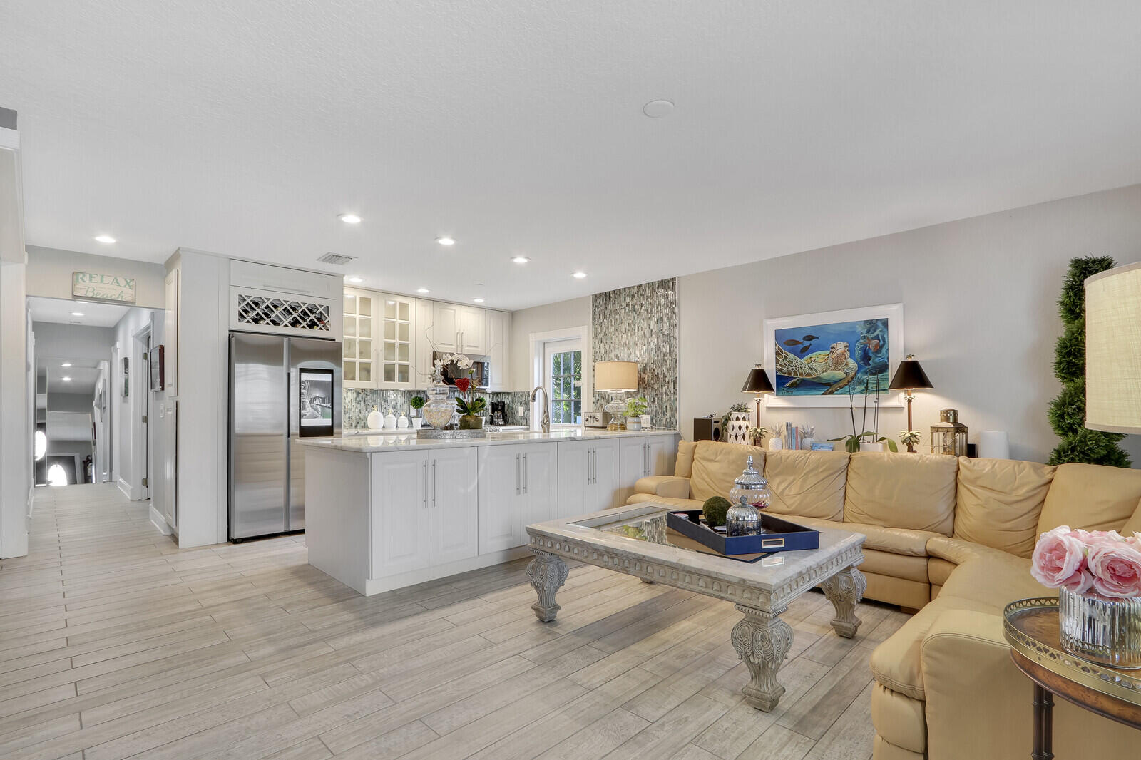503 North Perry Avenue Jupiter, FL 33458 - Photo 5 of 44 a living room with furniture and kitchen view