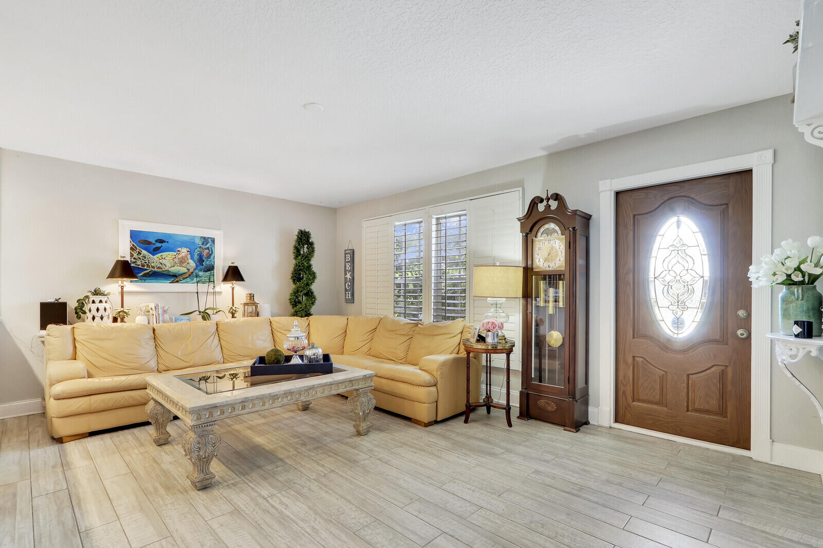 503 North Perry Avenue Jupiter, FL 33458 - Photo 6 of 44 a living room with furniture and a large window