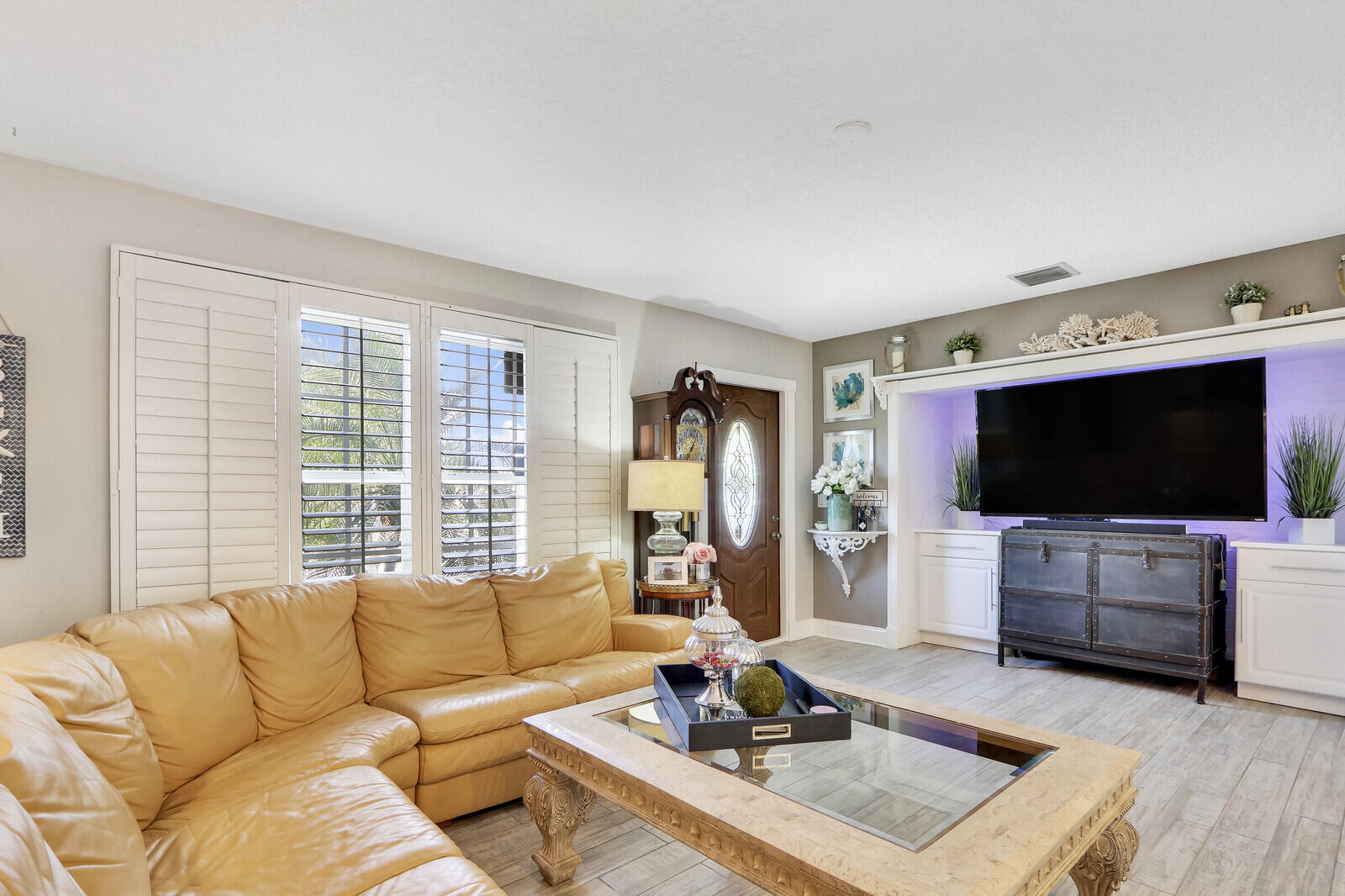 503 North Perry Avenue Jupiter, FL 33458 - Photo 7 of 44 a living room with furniture and a flat screen tv
