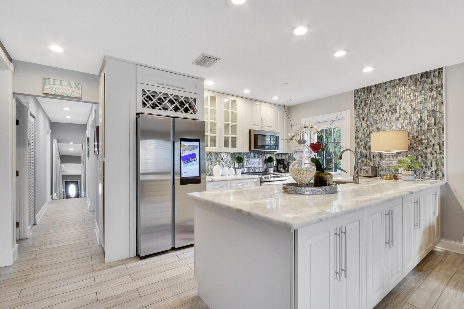 503 North Perry Avenue Jupiter, FL 33458 - Photo 9 of 44 a kitchen with stainless steel appliances granite countertop a refrigerator and a sink