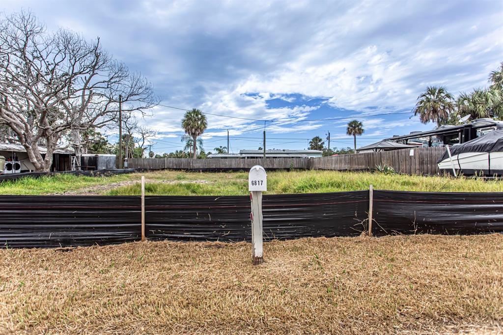 6813 Garden Drive New Port Richey, FL 34652 - Photo 1 of 8 a view of a pathway with a bench