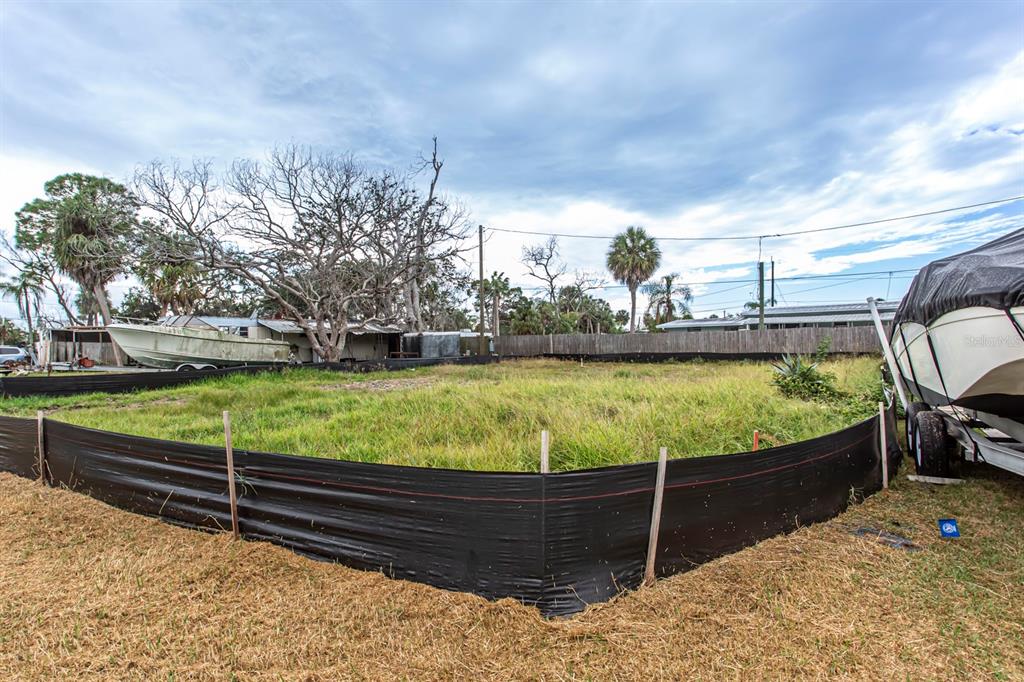 6813 Garden Drive New Port Richey, FL 34652 - Photo 3 of 8 a view of a swimming pool with a patio