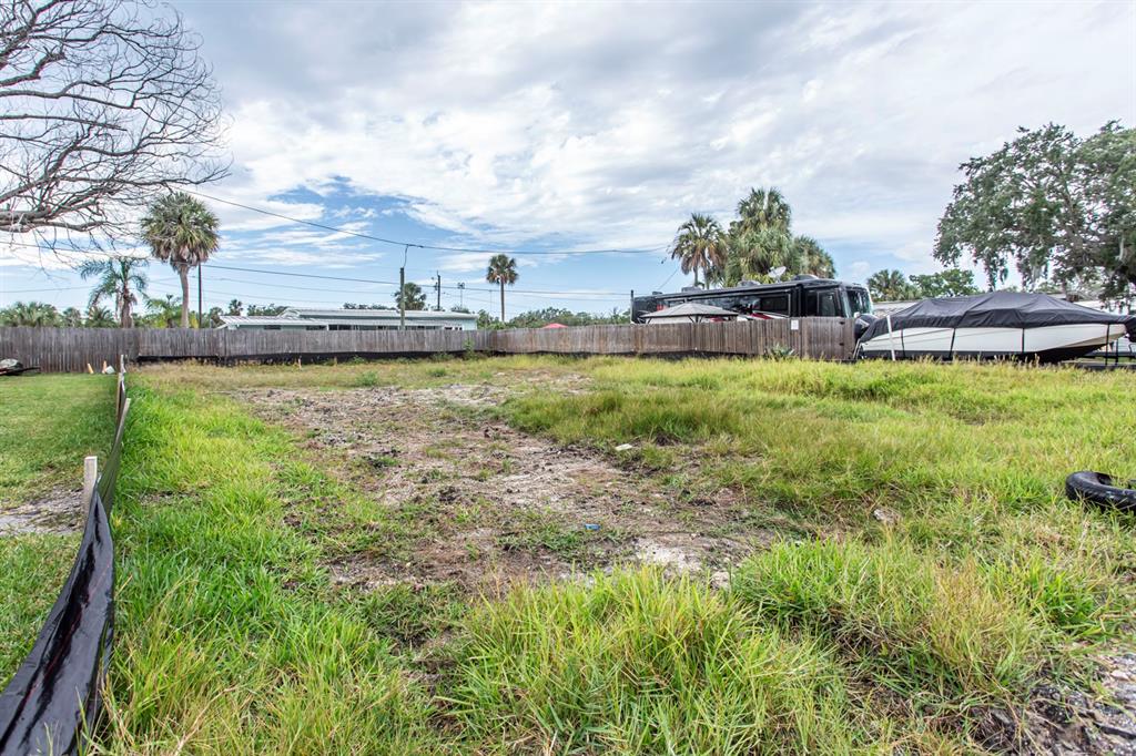 6813 Garden Drive New Port Richey, FL 34652 - Photo 5 of 8 a view of a lake with houses in the back