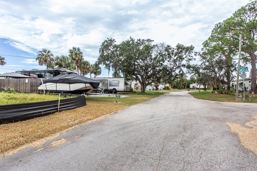 6813 Garden Drive New Port Richey, FL 34652 - Photo 7 of 8 a view of a house with swimming pool and sitting area