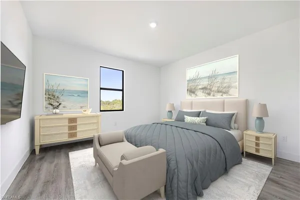 a bedroom with a large bed and a couch