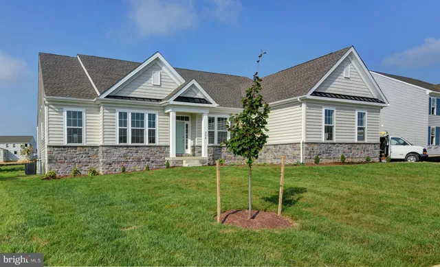 a view of kitchen with wooden floor and windows