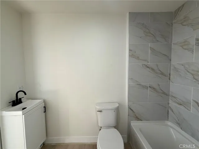 a bathroom with a toilet and a sink