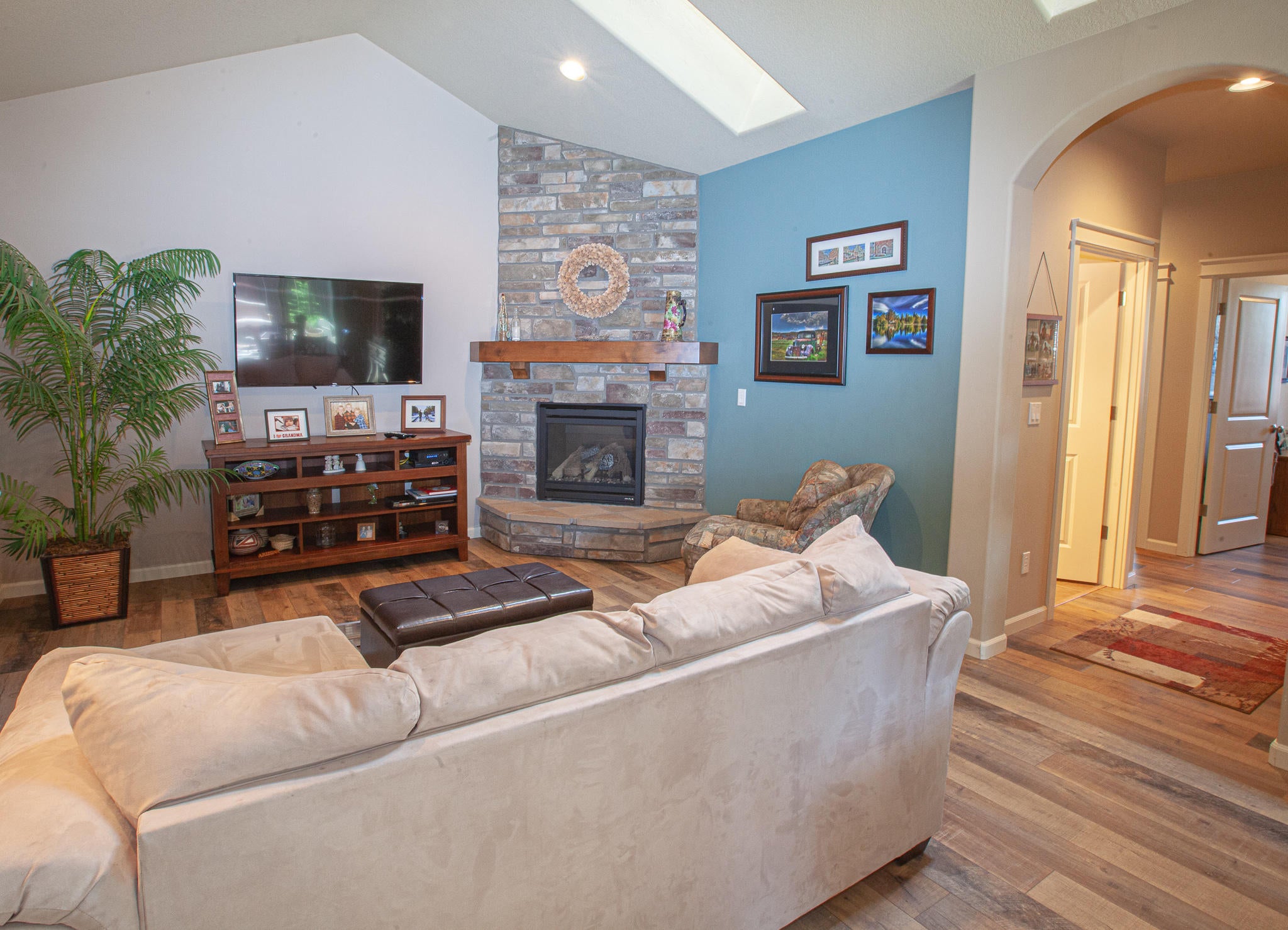 60251 Addie Triplett Loop Bend, OR 97702 - Photo 4 of 15 Stone fireplace, skylights, relaxing space