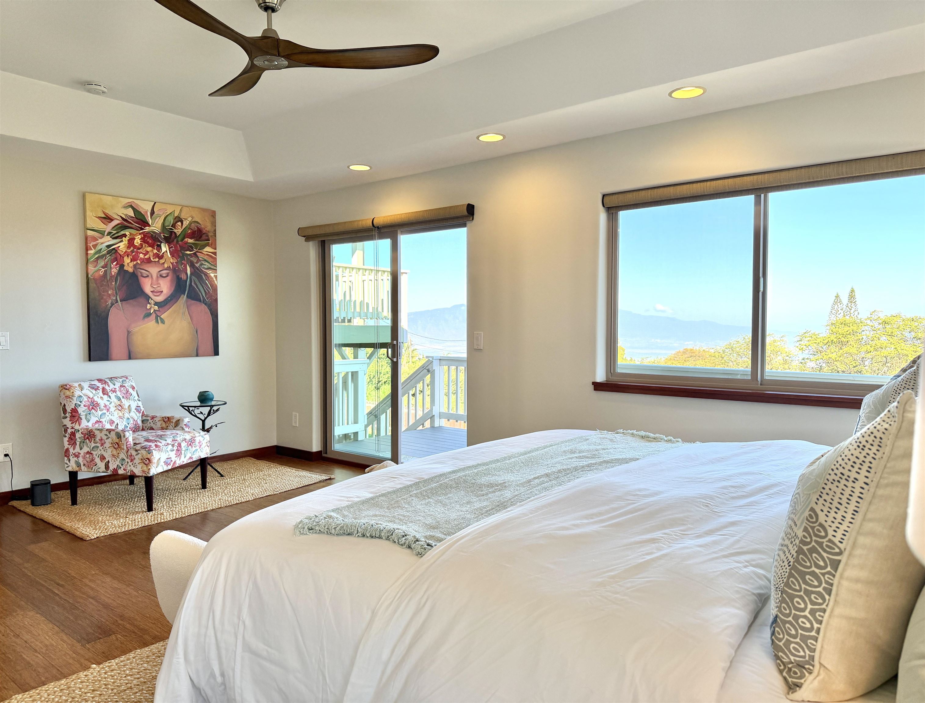 1350 Naalae Road Kula, HI 96790 - Photo 15 of 50 a bedroom with a bed painting on wall and a large window