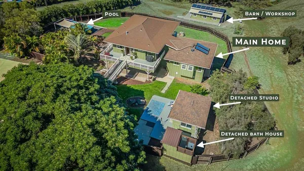 an aerial view of residential house with outdoor space and street view