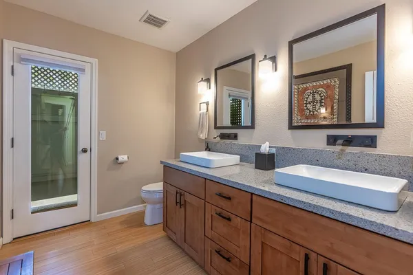 a bedroom with a bed couch and window